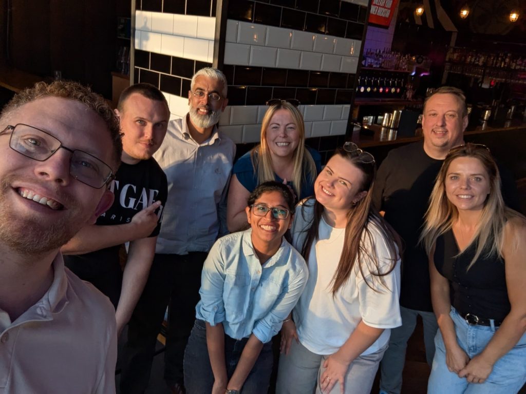 The QFM Group People and Culture team together at a team social